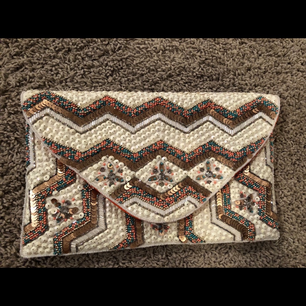 Cream envelop style beaded clutch